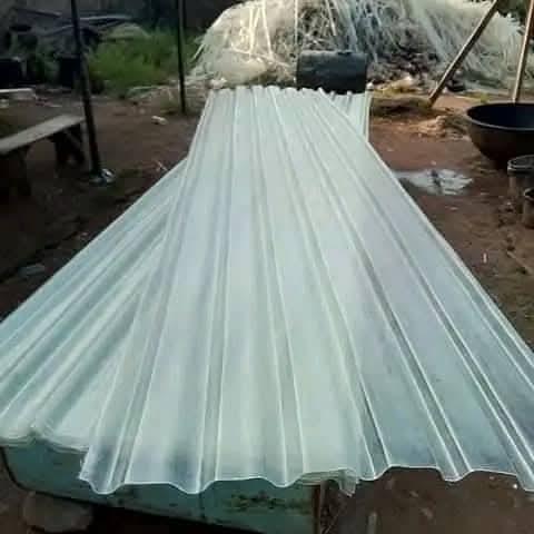 Finished clear corrugated fibre glass roofing sheets stacked and ready for delivery